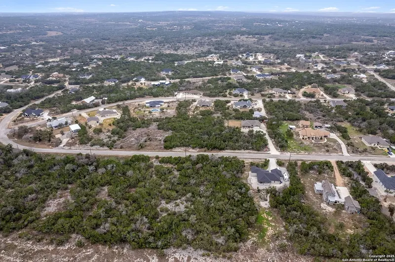 Aerial view of a Hill Country neighborhood among the oaks